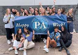 A group of students from George Washington University pose with a PA Week Banner